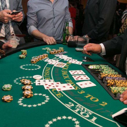 Some punters playing blackjack at a live casino