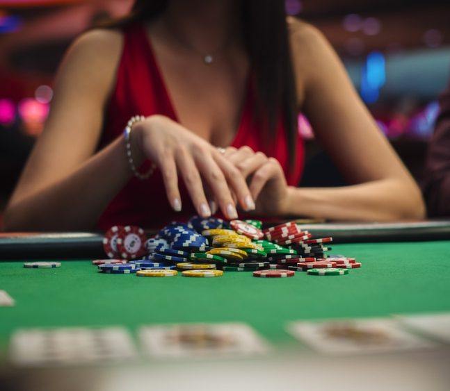 Woman playing poker for the ICM in poker article.