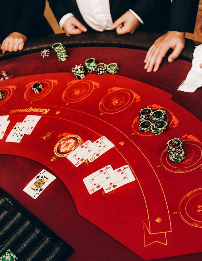 Casino dealer dealing cards and chips