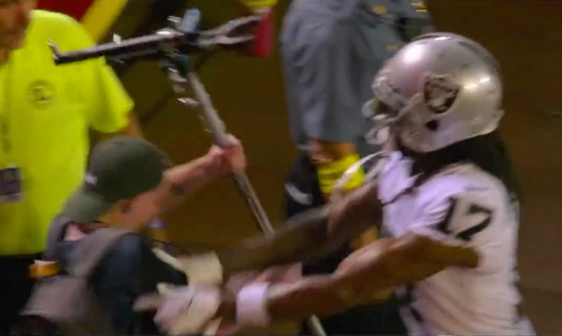 Raiders WR Davante Adams facing charge after shoving photographer