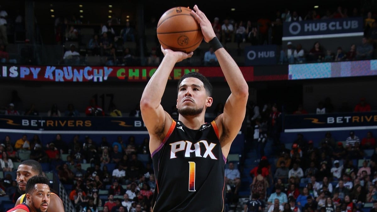 Devin Booker of the Phoenix Suns shoots a free throw against the